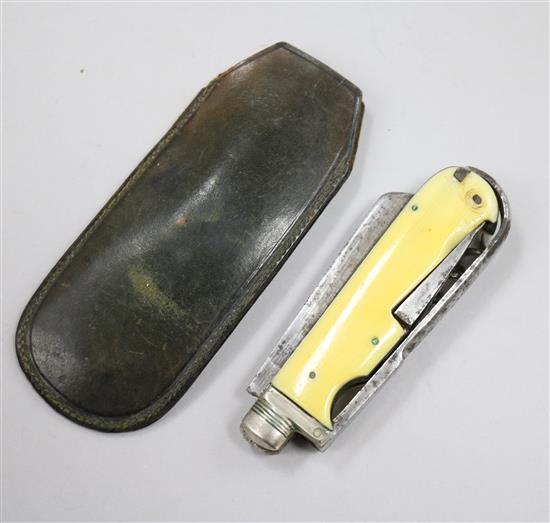 An ivory pen knife and a cased pair of spectacles
